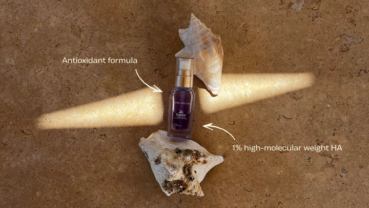 Luna Nectar Neptune Hydrate & Blur Serum bottle showing 1% high-molecular weight HA and antioxidant formula.