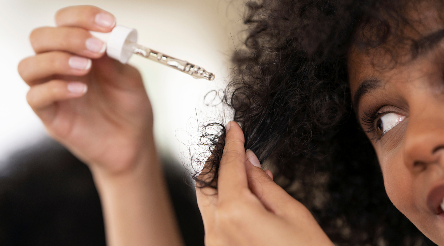 Applying a lightweight scalp serum to support hair density and scalp health